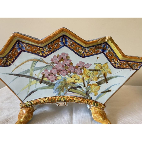 231 - A 19thC floral encrusted basket with a continental planter.