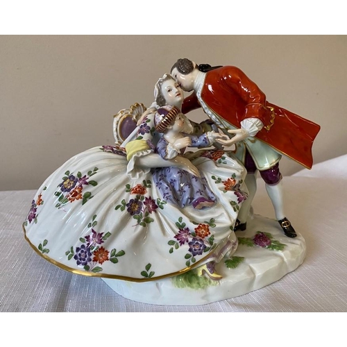 232 - A 20thC Meissen group, a couple with child.