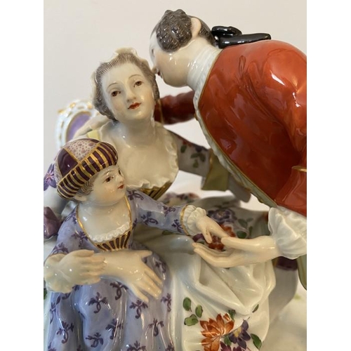 232 - A 20thC Meissen group, a couple with child.