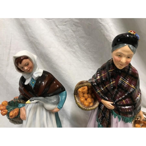 245 - Two Royal Doulton figurines. The Orange Lady HN1759, 21.5cms h and Country Lass HN1991, 20cms h.