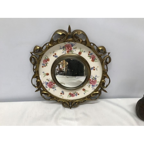 253 - A decorative circular brass mirror with Burleigh Ware rose pattern plate, 31cms d.