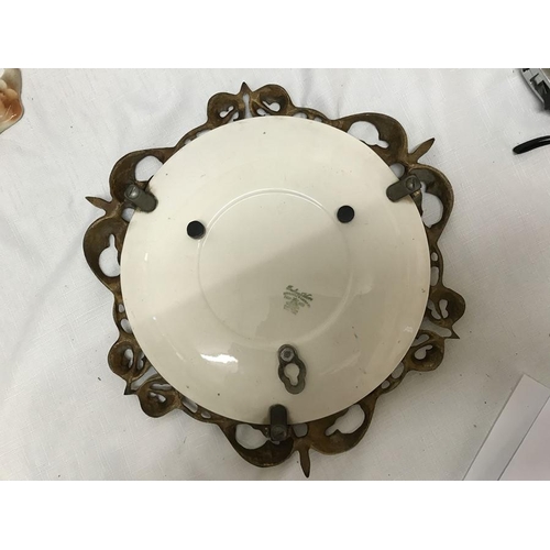 253 - A decorative circular brass mirror with Burleigh Ware rose pattern plate, 31cms d.