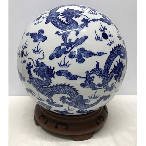 262A - Large Chinese Blue and White Dragon patterned pottery ball on carved wooden stand base 35cms h.