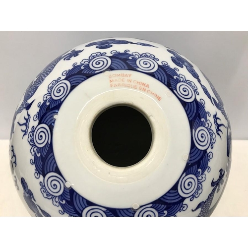 262A - Large Chinese Blue and White Dragon patterned pottery ball on carved wooden stand base 35cms h.