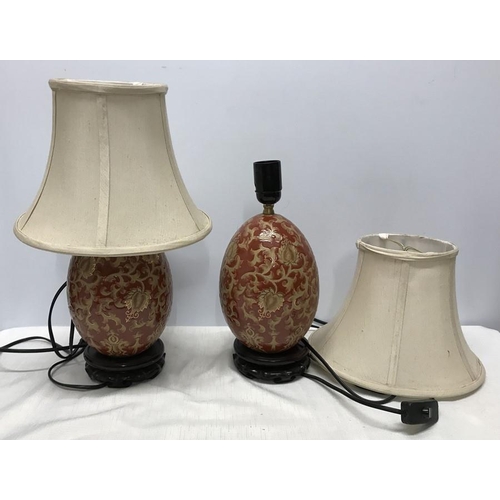 263 - Pair of Chinese pottery gilt and red floral and leaf pattern table lamps, egg shaped oval, on carved... 