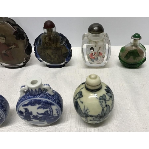 264 - Collection of 12 decorative glass and blue & white pottery Chinese scent bottles, 12.5cms tallest.