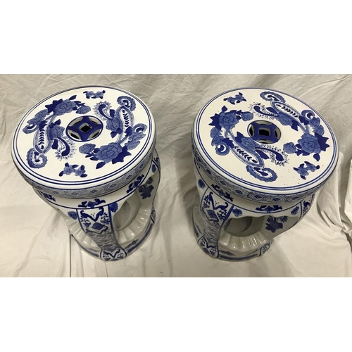 267 - Pair of Chinese blue and white pottery stools, floral pattern. 40 h x 30cms w.