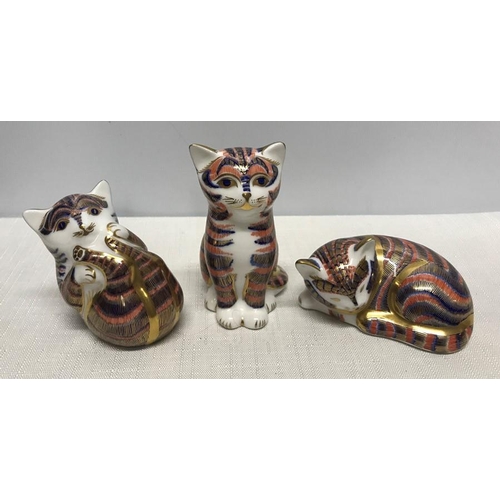 275 - Royal Crown Derby paperweight figures, Cats, Sleeping 4.5cms h, Playing 6cms h and Seated 8.5cms h.