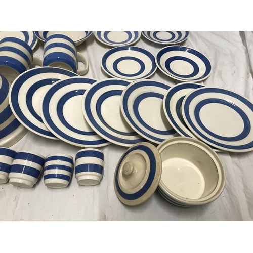 297 - Selection of Blue and white Cornish Ware. Dinner plates 25cms and 23cms w, various saucers, mugs, cu... 