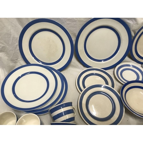 297 - Selection of Blue and white Cornish Ware. Dinner plates 25cms and 23cms w, various saucers, mugs, cu... 