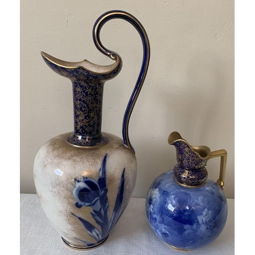 305 - Two Doulton Burslem blue and gilt vases. Tallest with scroll handle 36 cms h.