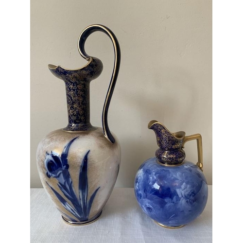 305 - Two Doulton Burslem blue and gilt vases. Tallest with scroll handle 36 cms h.