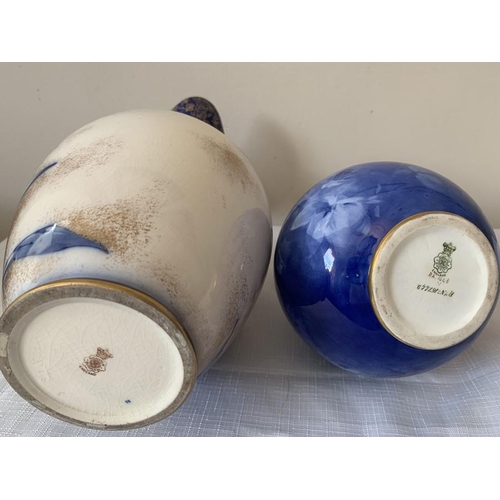 305 - Two Doulton Burslem blue and gilt vases. Tallest with scroll handle 36 cms h.