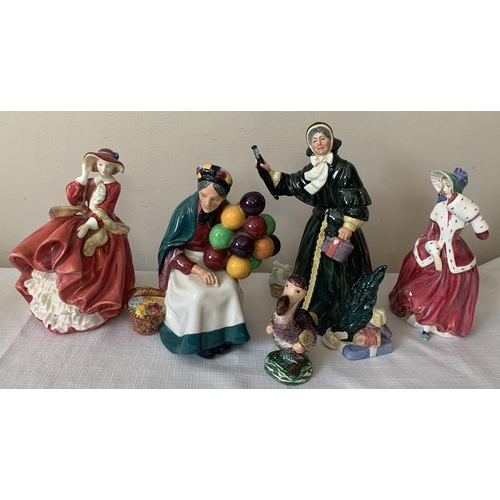 306 - Four Royal Doulton figurines and a Beswick figure. To include The Old Balloon Seller HN1315, Top 'O ... 