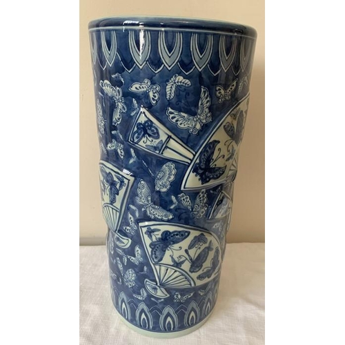 311 - Modern Chinese blue ground umbrella stand., decorated with fans and butterflies. 46cms h.