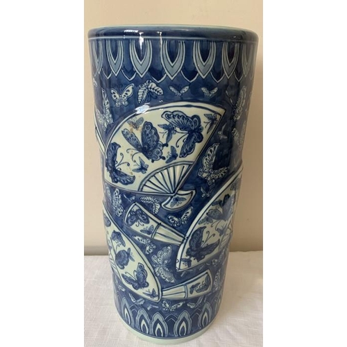 311 - Modern Chinese blue ground umbrella stand., decorated with fans and butterflies. 46cms h.