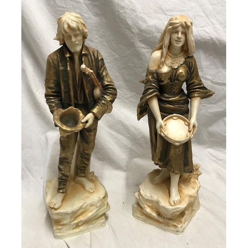 322 - Pair of continental porcelain figurines. Gilt and ivorine effect, street musicians, 34cms h.