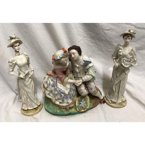 324 - Continental pottery figurine, Courting Couple 20cms h x 19cms w base x 11cms together with a pair of... 