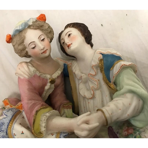 324 - Continental pottery figurine, Courting Couple 20cms h x 19cms w base x 11cms together with a pair of... 