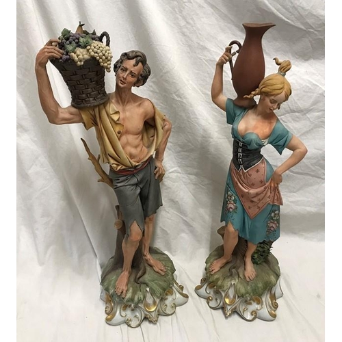 327 - Pair of capodimonte tall figurines signed G Pellati, lady with water jug and man with basket of frui... 