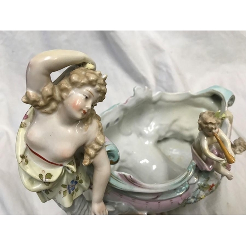 328 - Continental Italian pottery figures. Couple with boy and goose under a archway 22cms h c 23cms w and... 