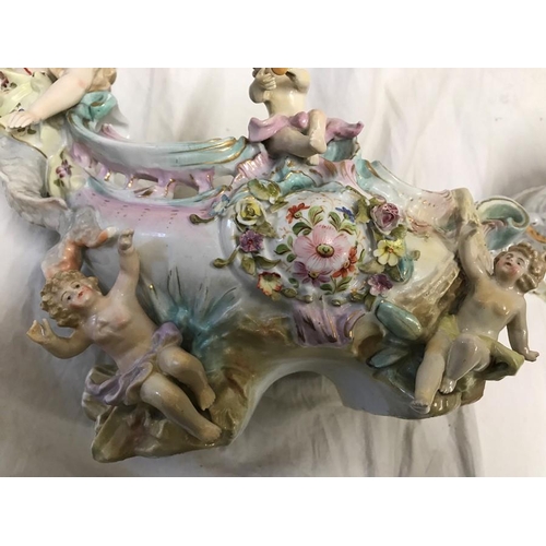 328 - Continental Italian pottery figures. Couple with boy and goose under a archway 22cms h c 23cms w and... 