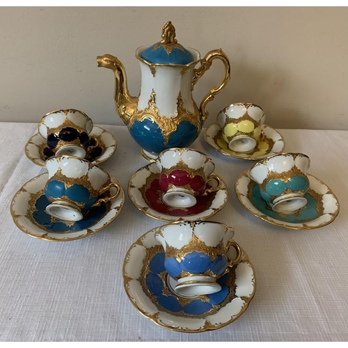 343 - A continental harlequin and gilt porcelain coffee service with blue mark to base, six cups and sauce... 