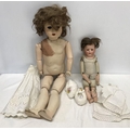 Two early 20thC dolls, Heubach 275 pot headed doll with leather body, 42cms h and a large Unica Belg... 