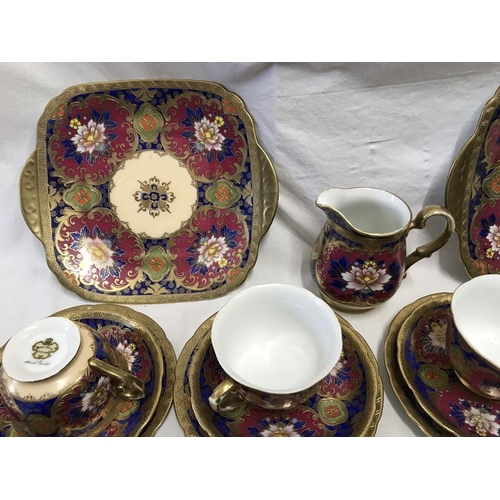 358 - Meito China hand painted part teaset, gilt and floral decoration, 12 trios, 2 cake plates 24cms w an... 