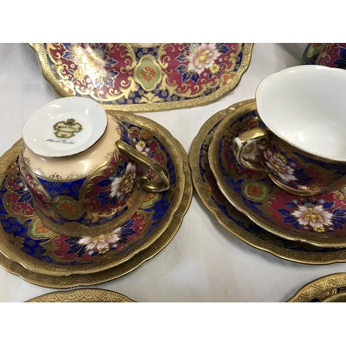 358 - Meito China hand painted part teaset, gilt and floral decoration, 12 trios, 2 cake plates 24cms w an... 