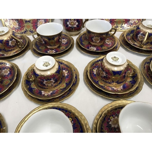 358 - Meito China hand painted part teaset, gilt and floral decoration, 12 trios, 2 cake plates 24cms w an... 