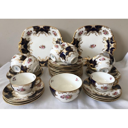 366 - A Coalport tea service, 12 saucers, 12 plates, 12 cups, 1 sugar bowl and 2 cake plates.