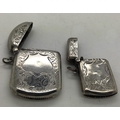 Two hallmarked silver vesta cases, both with vacant cartouche. Birmingham 1910 and Birmingham 1911. ... 