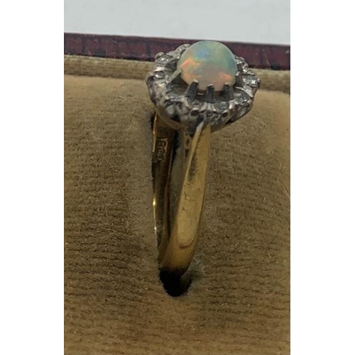 67 - Opal and diamond cluster dress ring set in 18ct gold, size M, 3.6gms total weight.