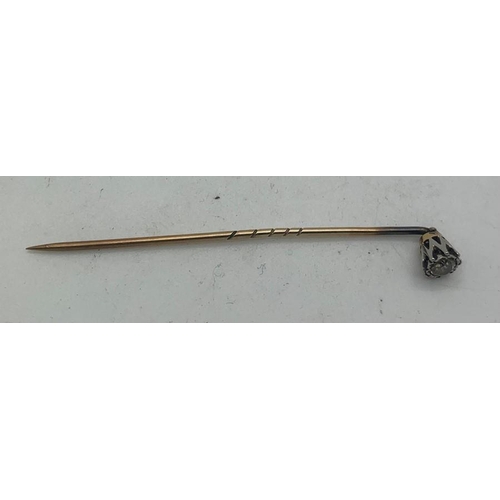 694 - A diamond set tie pin, metal unmarked. 1.3gms total weight.