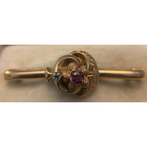 704 - A 9ct gold bar brooch set with central amethyst and one diamond. In original fitted case. 5.4gms tot... 