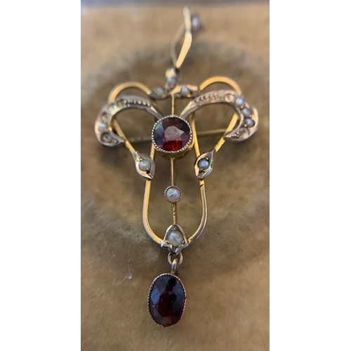 706 - A 9ct gold art nouveau drop pendant and brooch set with seed pearls and red stones. 2.,6gms. 4.5cms ... 