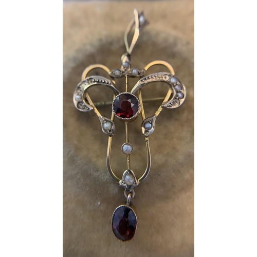 706 - A 9ct gold art nouveau drop pendant and brooch set with seed pearls and red stones. 2.,6gms. 4.5cms ... 