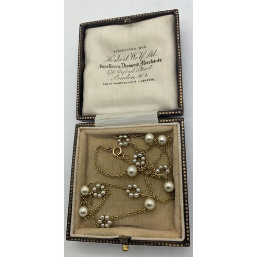 707 - A 9ct gold and seed pearl chain necklace 38cms l. 3.5gms in contemporary silk lined box.