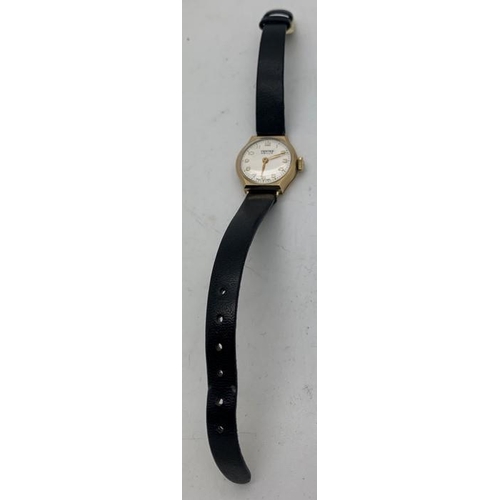 711 - A 9ct gold cased ladies Vertex Revue wristwatch on black leather strap. Awarded for service to BTR i... 