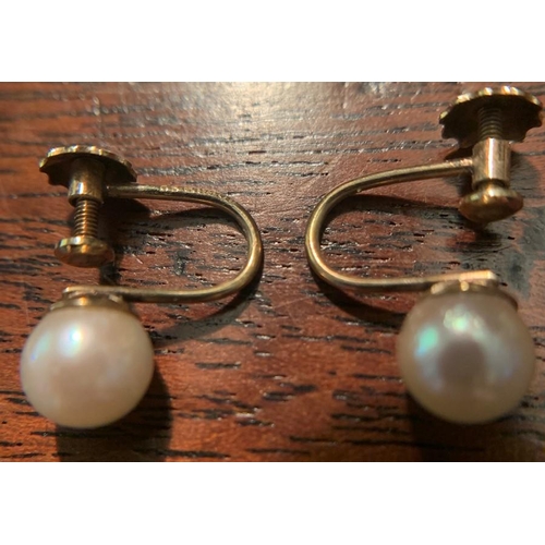 715 - A pair of 9ct gold earrings 1.7gms with a triple strand simulated pearl necklace with diamante clasp... 