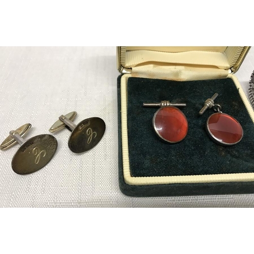 718 - Two pairs of Gents silver cufflinks, one pair hallmarked T and D Ltd Birmingham 1980. One pair 925 s... 