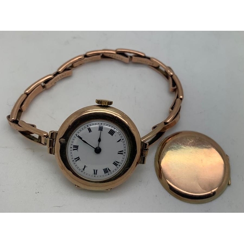 72 - A 9ct gold ladies wristwatch with elasticated gold strap. 19.6gms total weight.