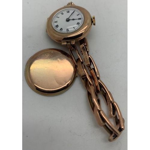 72 - A 9ct gold ladies wristwatch with elasticated gold strap. 19.6gms total weight.