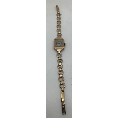 74 - A 9ct gold ladies wristwatch and strap. 12.2gms total weight.