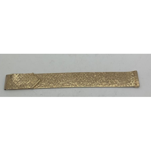 741 - A 1970's 9ct yellow gold bark effect cuff style bracelet. 67.3gms weight. 18cms l.