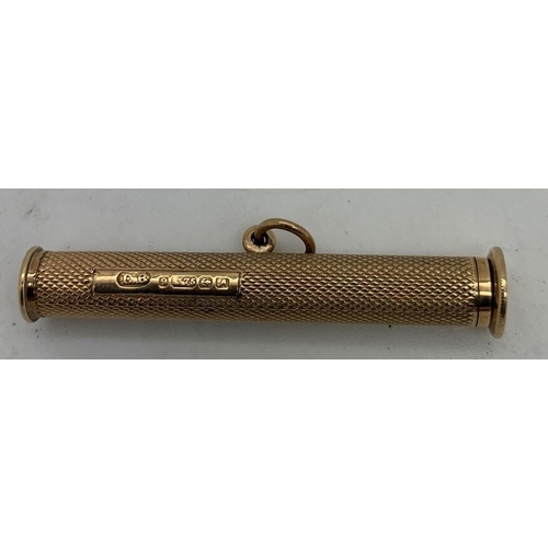 742 - A 9ct gold engine turned cigar pricker. 9.6gms.