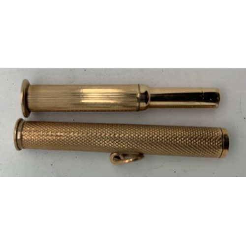 742 - A 9ct gold engine turned cigar pricker. 9.6gms.