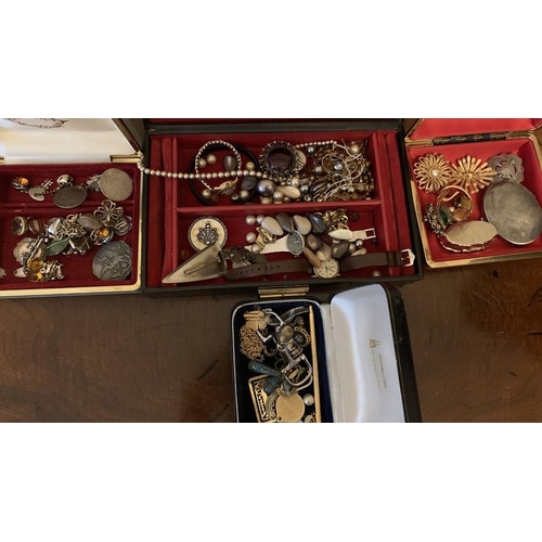 747 - A quantity of vintage costume jewellery to include Trifari brooch, necklaces, watches etc.