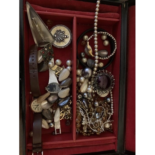 747 - A quantity of vintage costume jewellery to include Trifari brooch, necklaces, watches etc.